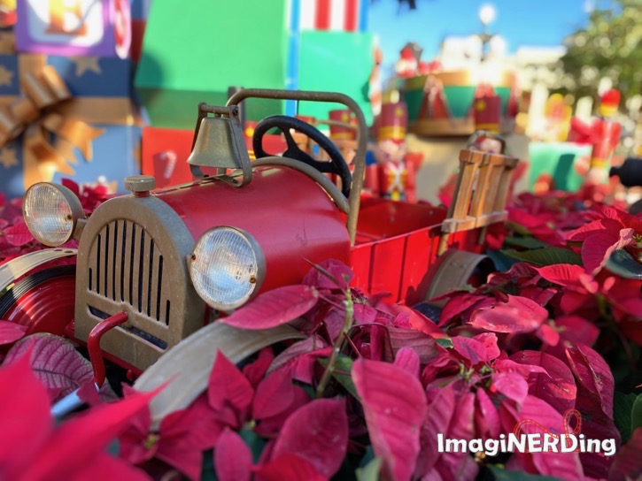 child's toy fire truck under the christmas tree at the magic kingdom