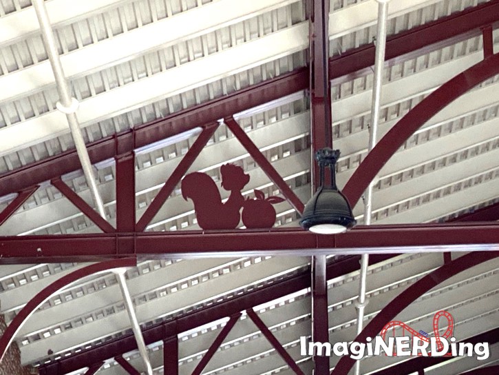 steel cutout of a squirrel in the disney market building at disney springs