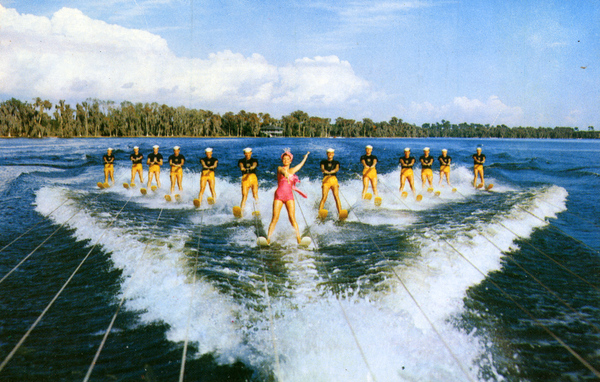 Cavalcade of excellent water skiers led by Esther Williams, famous star of Metro-Goldwyn-Mayer, is shown in one of the great water shows of Cypress Gardens, in preparation of one of the newest movies taken in this beautiful attraction of Florida.